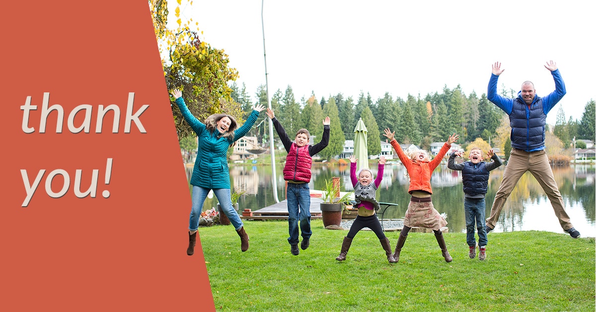 5 members of a family (2 adult, 3 youth) jump in the air. text says "thank you"