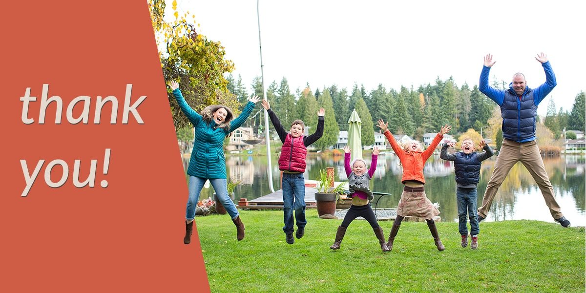 5 members of a family (2 adult, 3 youth) jump in the air. text says "thank you"